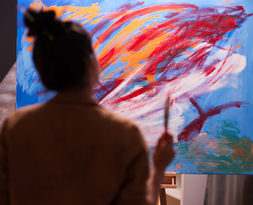 Back View Of An Artist Painting Abstract Piece