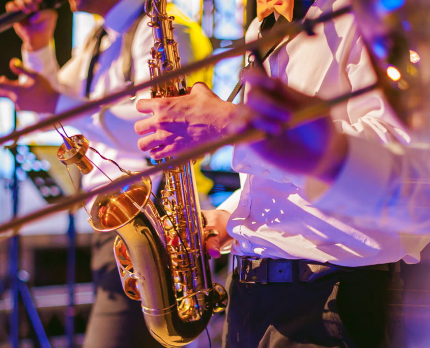 Side view of musician playing saxophone Side View Of Musician Playing Saxophone