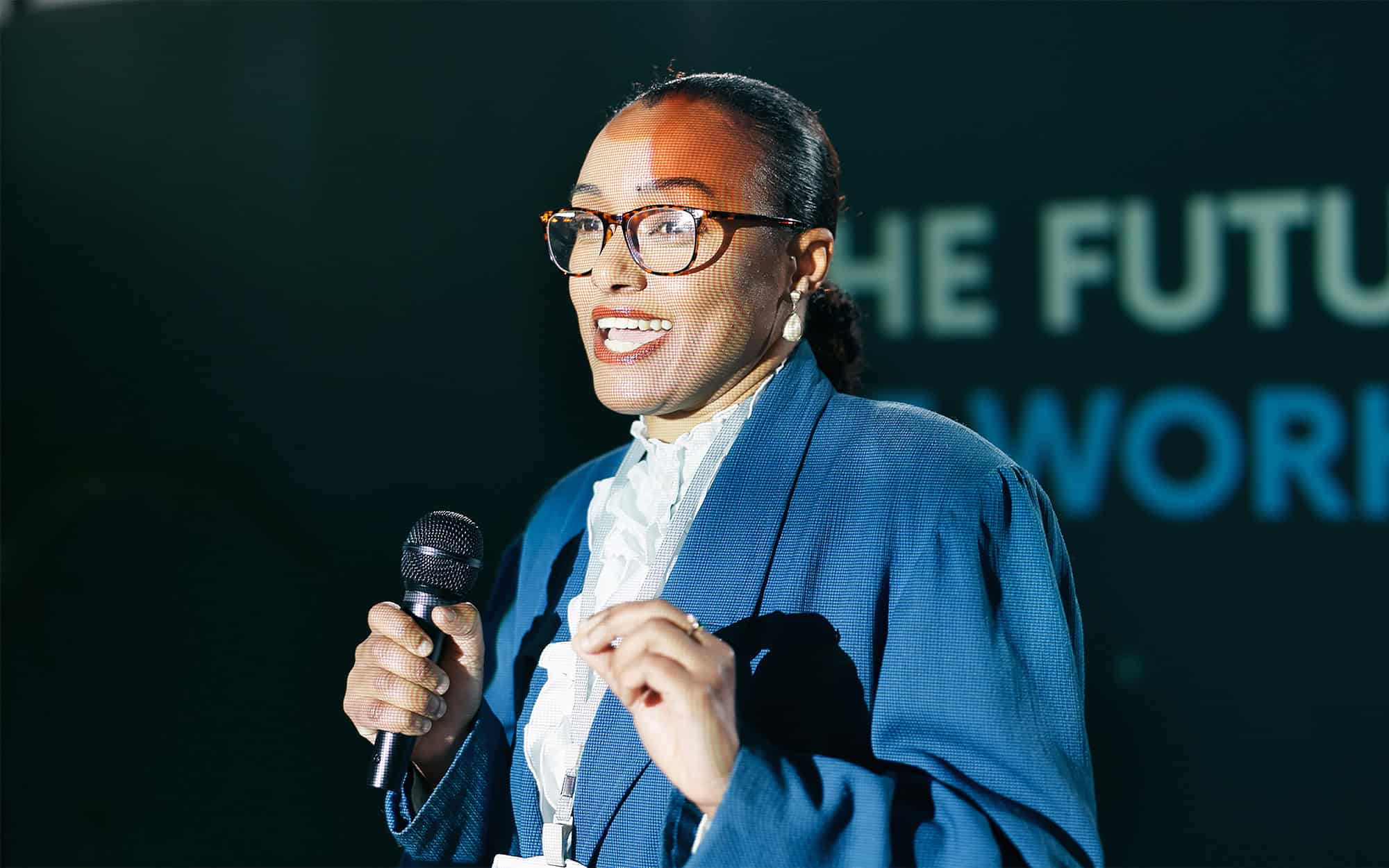Side View Of Woman In Glasses Doing Public Speaking